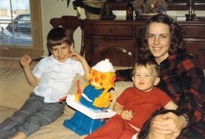 Kathy hanging out with Mike (left), Sam, and their awesome robot in the early 80's.
